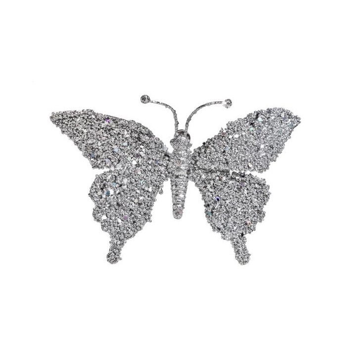 Papillon brillant en cristaux argentés, aux ailes délicates et scintillantes.