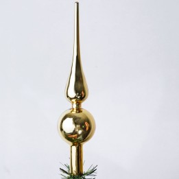 Pointe dorée brillante, forme élégante avec un style festif.