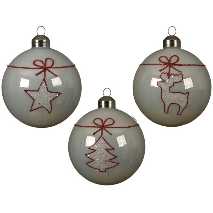 Trois boules de Noël blanches ornées de motifs en rouge et paillettes.