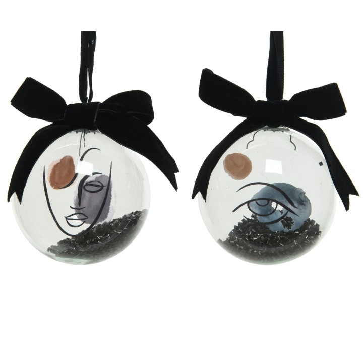 Boules décoratives en verre, visages stylisés, teintes douces, accents noirs en velours.