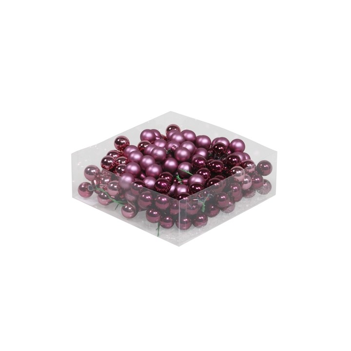 Perles violettes et bordeaux brillantes dans une boîte transparente, éclat festif.