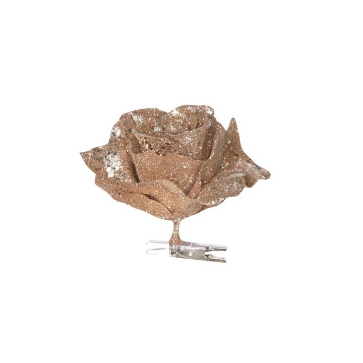 Rose en métal doré, scintillante, avec un support en clip transparent.