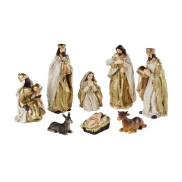 Scène de crèche de Noël avec figurines dorées et animaux en céramique.