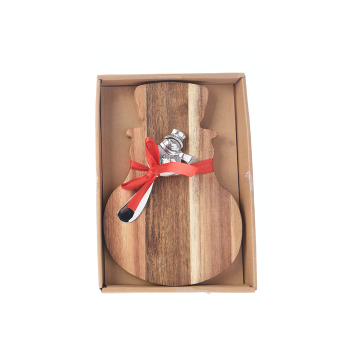 Planche en bois en forme de guitare avec un couteau, décorée d'un ruban rouge.