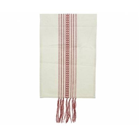 Tissu beige orné de motifs rouges avec des franges délicates aux extrémités.