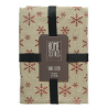 Nappe beige ornée de flocons rouges, élégante et festive, parfaite pour les repas d'hiver.