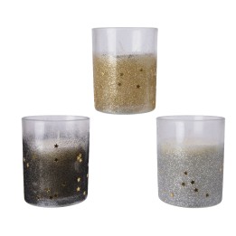 Trois bougies décorées de paillettes dorées et argentées, évoquant une ambiance festive.
