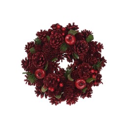 Couronne décorative rouge ornée de pommes, pommes de pin et feuillage brillant.
