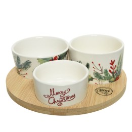 Trois bols en céramique décorés de motifs festifs sur un plateau en bois.