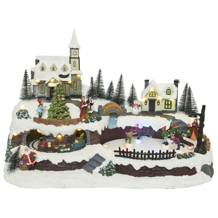 Village enneigé animé avec maisons, église, sapin et personnages festifs illuminés.