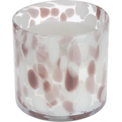 Bougie dans un récipient en verre aux motifs marbrés roses et blancs, élégant et moderne.