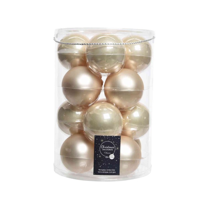 Boules décoratives brillantes dans un contenant transparent, aux teintes dorées et argentées.