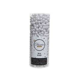 Perles décoratives blanches dans un tube transparent, idéal pour l'artisanat.