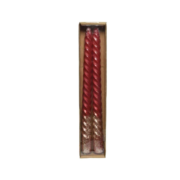 Deux bougies torsadées rouges avec paillettes dorées, présentées dans une boîte en carton.