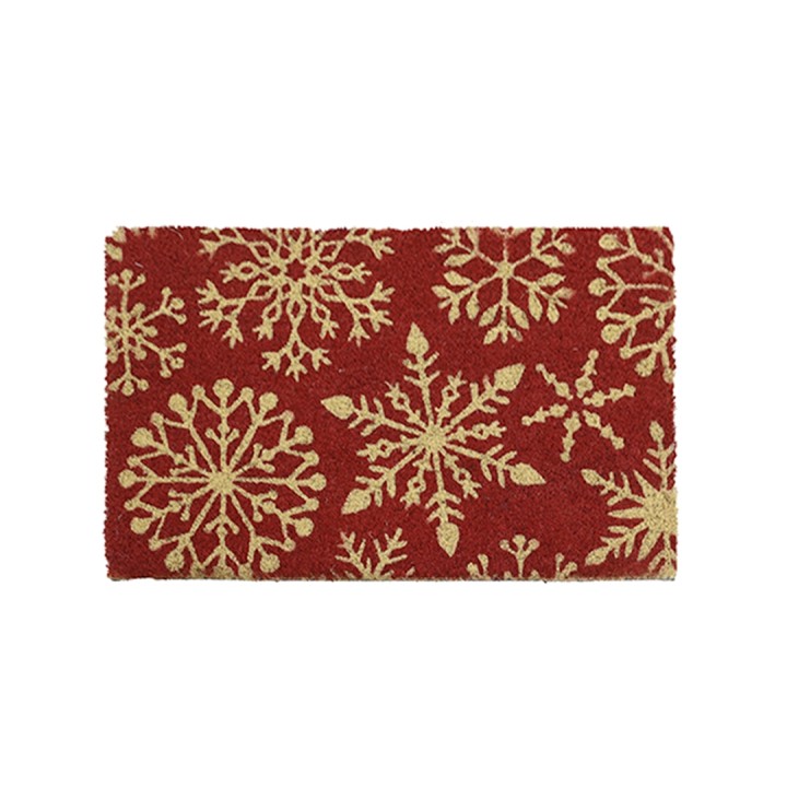 Tapis rouge décoré de flocons de neige dorés, évoquant une ambiance festive.