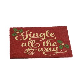 Tapis de bienvenue rouge avec un texte doré et des motifs de houx verts.
