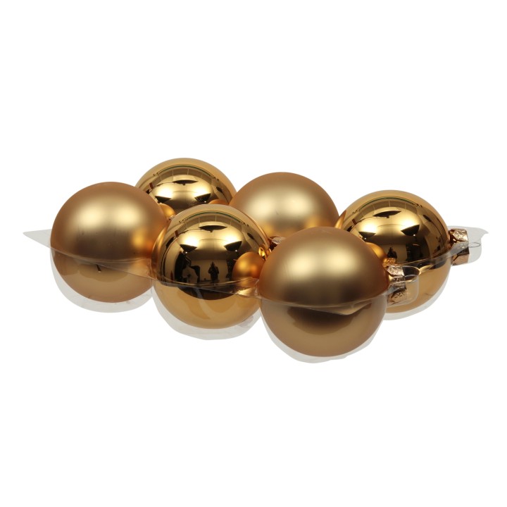 Six boules dorées brillantes, unies et lisses, disposées en ligne sur un support transparent.