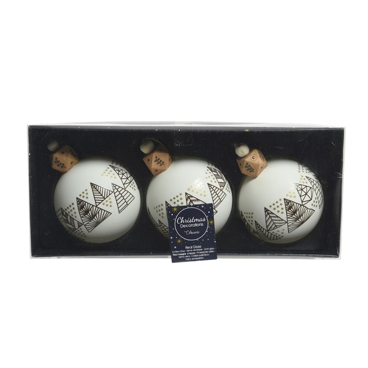 Trois boules de Noël blanches ornées de motifs géométriques noirs, présentées dans une boîte.