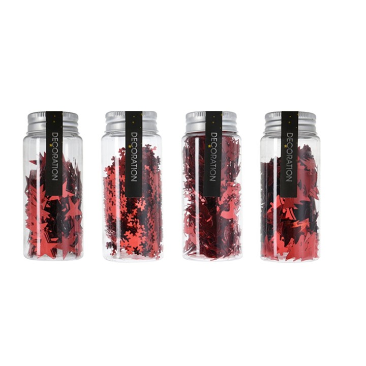 Quatre bocaux transparents remplis de confettis rouges en forme d'étoiles.