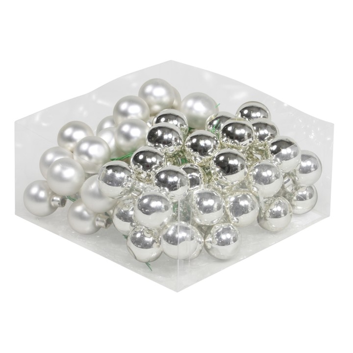 Perles brillantes blanches et argentées, disposées en un joli désordre sur un fond neutre.