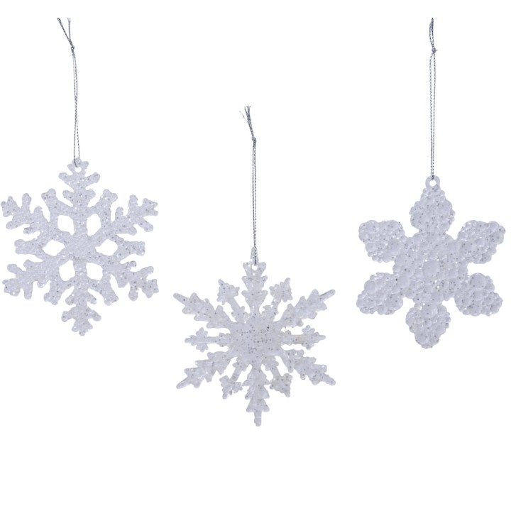 Flocons de neige scintillants, blancs, suspendus, aux formes variées et délicates.