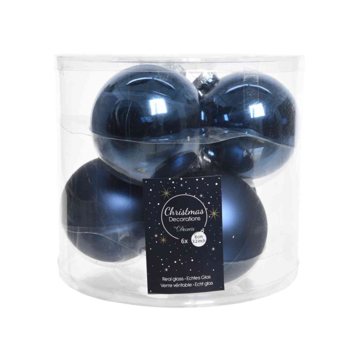 Boules de Noël bleu nuit, brillantes, dans un emballage transparent, élégantes et festives.