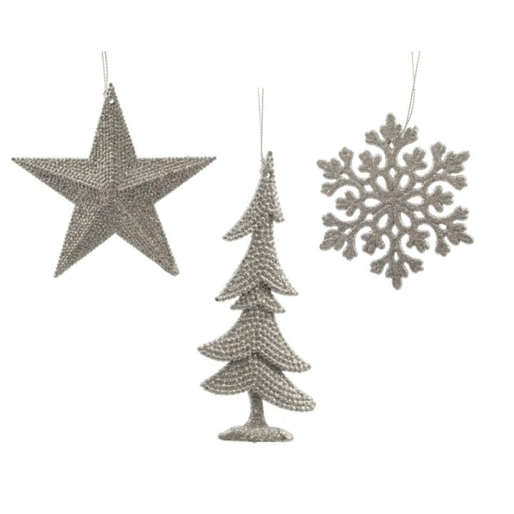 Décorations scintillantes en argent : étoile, sapin et flocon de neige stylisés.