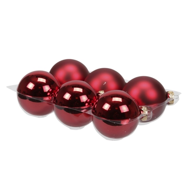 Six boules de Noël rouges brillantes, disposées en deux rangées sur un support argenté.