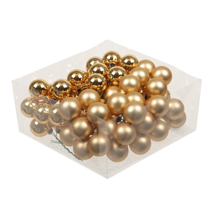 Boules décoratives dorées brillantes, en plastique, dans une boîte transparente.
