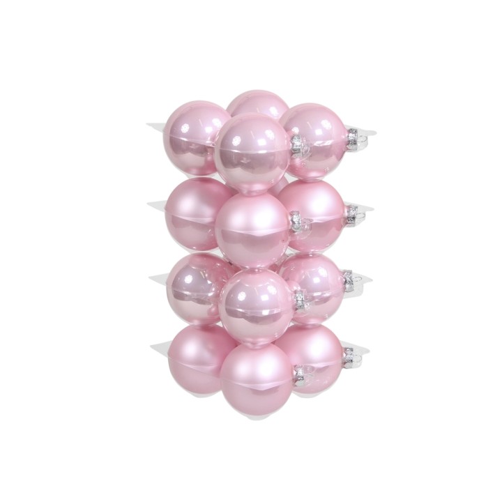 Boules de Noël rose pâle, brillantes et lisses, disposées en une belle colonne.