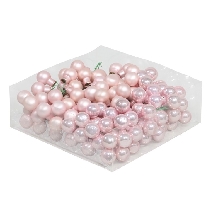 Perles roses et nacrées, dans un emballage transparent, aux formes rondes et brillantes.