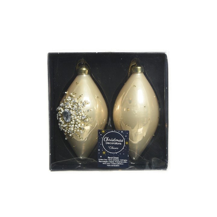 Deux ornements de Noël dorés, élégants, avec des détails en perles et un emballage festif.