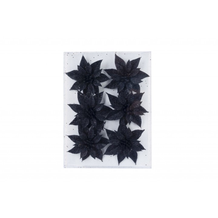 Fleurs noires en papier sur fond blanc, créant un contraste élégant et moderne.
