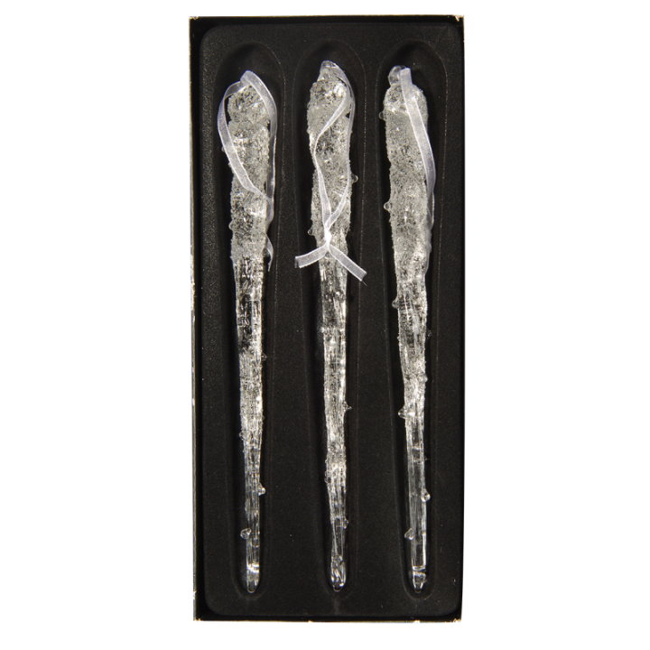 Trois pipettes en verre transparent, délicates, dans un écrin noir.