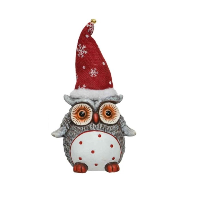 Chouette festive avec un bonnet rouge à pois blancs, aux yeux expressifs et corps arrondi.