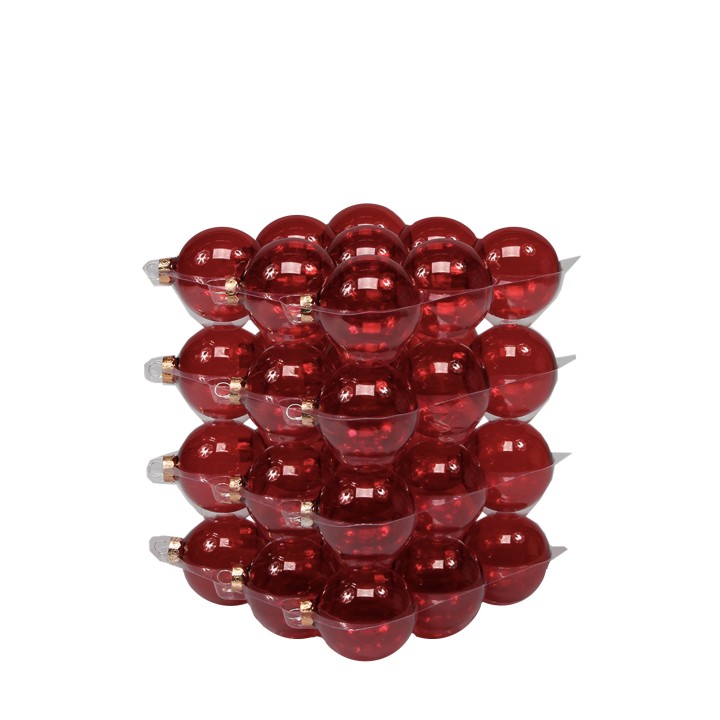 Empilement de boules en plastique rouge, brillantes et translucides, disposées en couches.