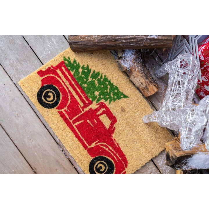 Tapis de sol en jute illustrant un vieux camion rouge avec un sapin vert.