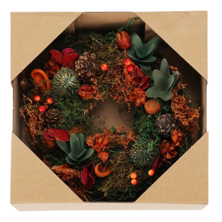Couronne de fleurs séchées aux teintes chaudes, présentée dans un emballage en carton.