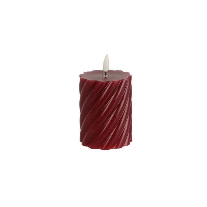 Bougie cylindrique rouge, texturée en spirale, avec une mèche blanche délicate.