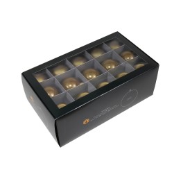 Boîte noire élégante contenant des boules dorées brillantes, agencées en rangées.