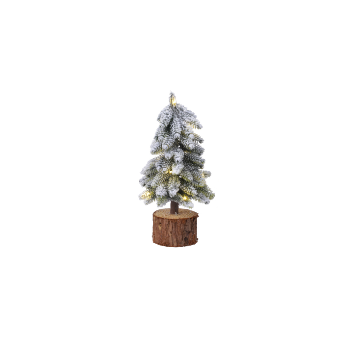 Sapin enneigé sur socle en bois, décoré de lumières dorées scintillantes.