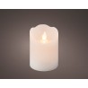 Bougie lumineuse blanche, douce lueur vacillante sur fond sombre. Bougie lumineuse blanche, douce lueur vacillante sur fond sombre.