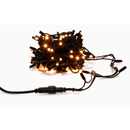 Guirlande lumineuse noire enroulée, éclairage doux avec ampoules jaunes scintillantes.