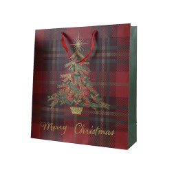 Sac cadeau festif aux motifs écossais, décoré d'un sapin et d'étoiles dorées.