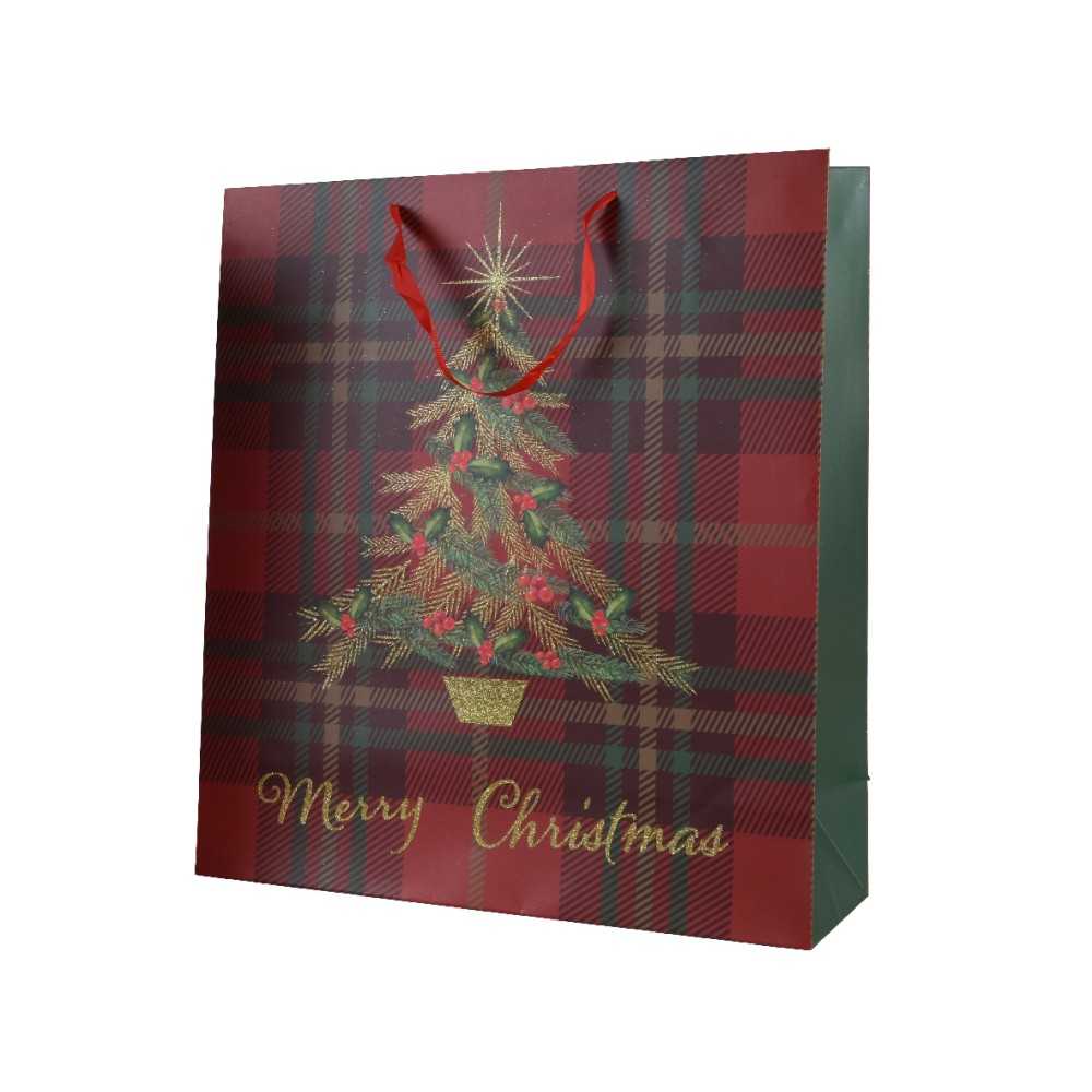 Sac cadeau festif aux motifs écossais, décoré d'un sapin et d'étoiles dorées.