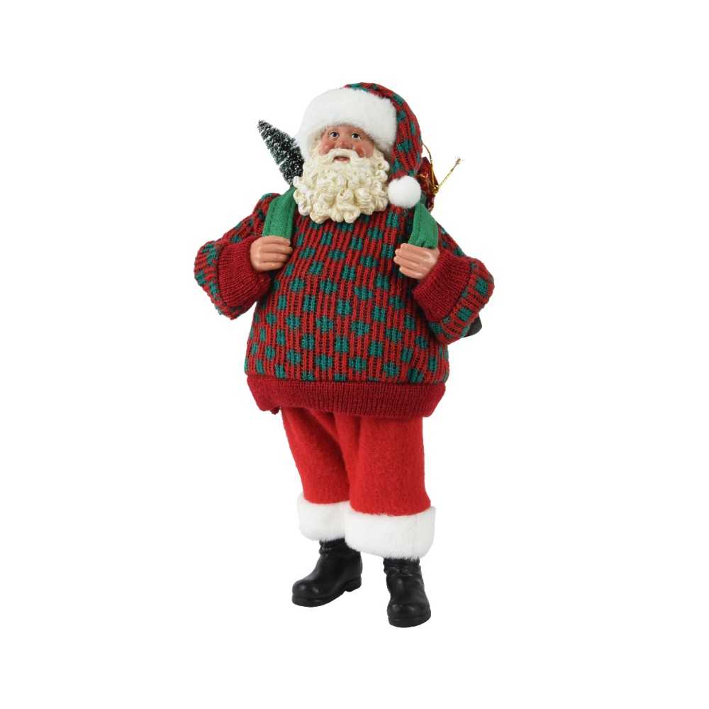 Père Noël jovial en pull tricoté, sac à dos, arborant des couleurs festives et un sourire cha...