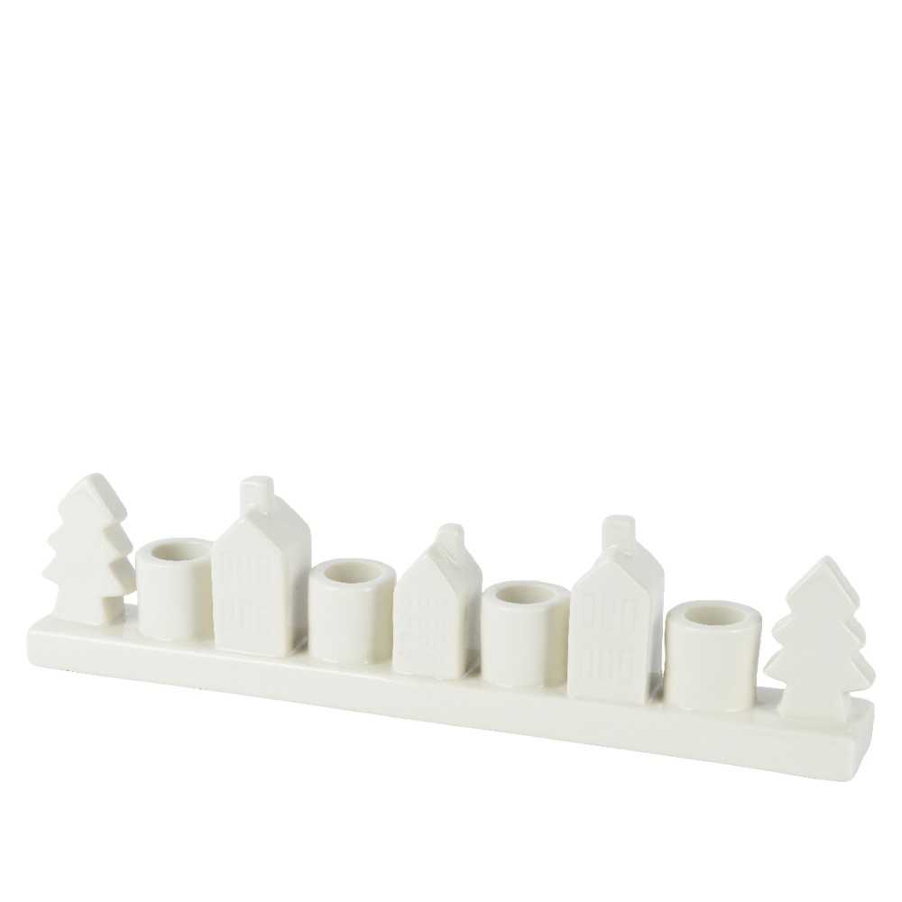 Candelabre en céramique blanche, forme de maisons et sapins stylisés.