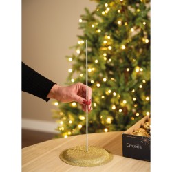 Support doré scintillant pour décoration, avec une tige droite et un fond festif.