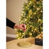 Support doré scintillant pour décoration, avec une tige droite et un fond festif.