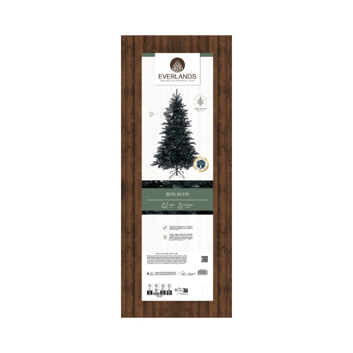 Étiquette d'un sapin artificiel sur fond bois, avec des informations et un design épuré.